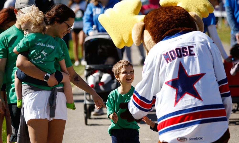 Cassie Weis and her son walk at the Strong Stroll.